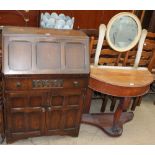 A 20th century oak bureau, with a panelled drop front,