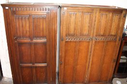 A 20th century oak hall robe together with two other oak wardrobes