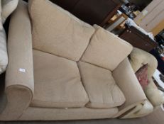 An upholstered two seater settee together with an upholstered armchair