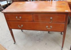 An Edwardian mahogany dressing table with a rectangular top,