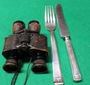 A pair of Ogee Oigelet 8 x binoculars together with a knife and fork set,