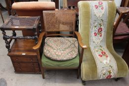 An Edwardian nursing chair with a floral tapestry panel, together with an elbow chair,