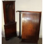 A reproduction mahogany standing corner cupboard together with an Edwardian mahogany double bed