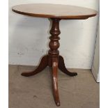 A Victorian mahogany tripod table with a turned column and spreading legs