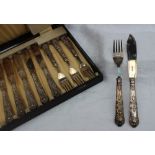 A George V silver handled kings pattern fish set, comprising six knives, six forks and fish servers,