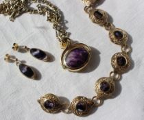 A 9ct gold banded amethyst revolving fob seal on a 9ct gold chain together with a similar bracelet