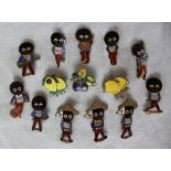 A collection of fourteen Fattorini & Sons Golden shred Gollywog pin badges including a cricketer,