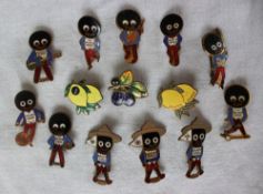 A collection of fourteen Fattorini & Sons Golden shred Gollywog pin badges including a cricketer,