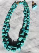 A double strands irregular turquoise necklace to a 9ct gold clasp,