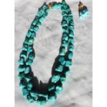 A double strands irregular turquoise necklace to a 9ct gold clasp,