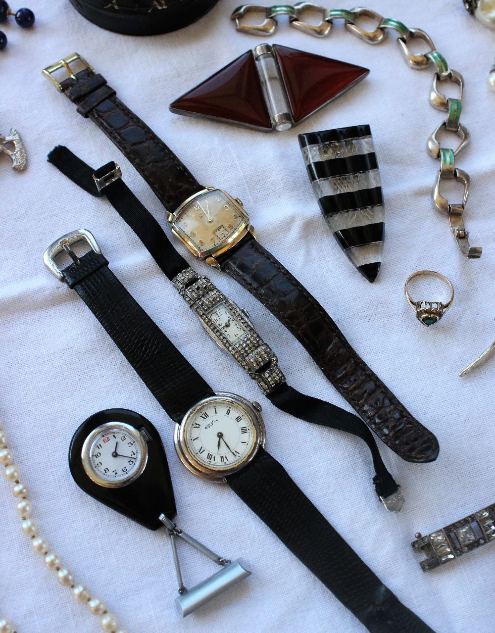 A paste set cocktail watch, with a rectangular dial and Arabic numerals,