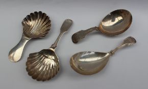 A William IV Scottish silver caddy spoon, with a fiddle pattern handle and shell shaped bowl,