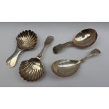 A William IV Scottish silver caddy spoon, with a fiddle pattern handle and shell shaped bowl,