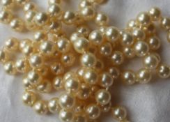 A pair of cultured pearl necklaces, with regular pearls each approximately 8mm diameter,