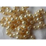 A pair of cultured pearl necklaces, with regular pearls each approximately 8mm diameter,