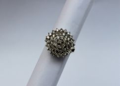 A diamond cluster ring,
