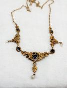 A Continental yellow metal necklace set with five circular faceted sapphires and three pearls to a