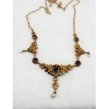 A Continental yellow metal necklace set with five circular faceted sapphires and three pearls to a