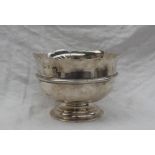 An Elizabeth II Irish silver bowl with a shaped rim and ring turned body on a spreading foot,