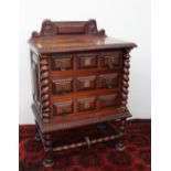 A 20th century rosewood topped chest,