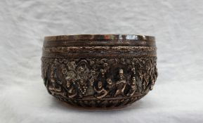 An Indian white metal bowl embossed with figures, scrolls, flowerheads and leaves, 14.