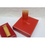 An S.J. Dupont gold plated lighter, No.