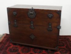 A Continental pine blanket box, the rectangular top with cast iron straps and clasp,