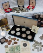 A set of seven silver coins produced to commemorate the 80th birthday of Her Majesty the Queen