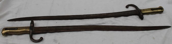 Two French Franco-Prussian War period Bayonets the saber-style bayonet with 57cm and 57.