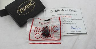 A piece of Titanic coal, with certificate stating "This coal was recovered from the wreck of R.M.S.