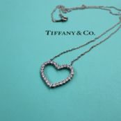 A Tiffany & Co. platinum large outline diamond set heart, approximately 0.