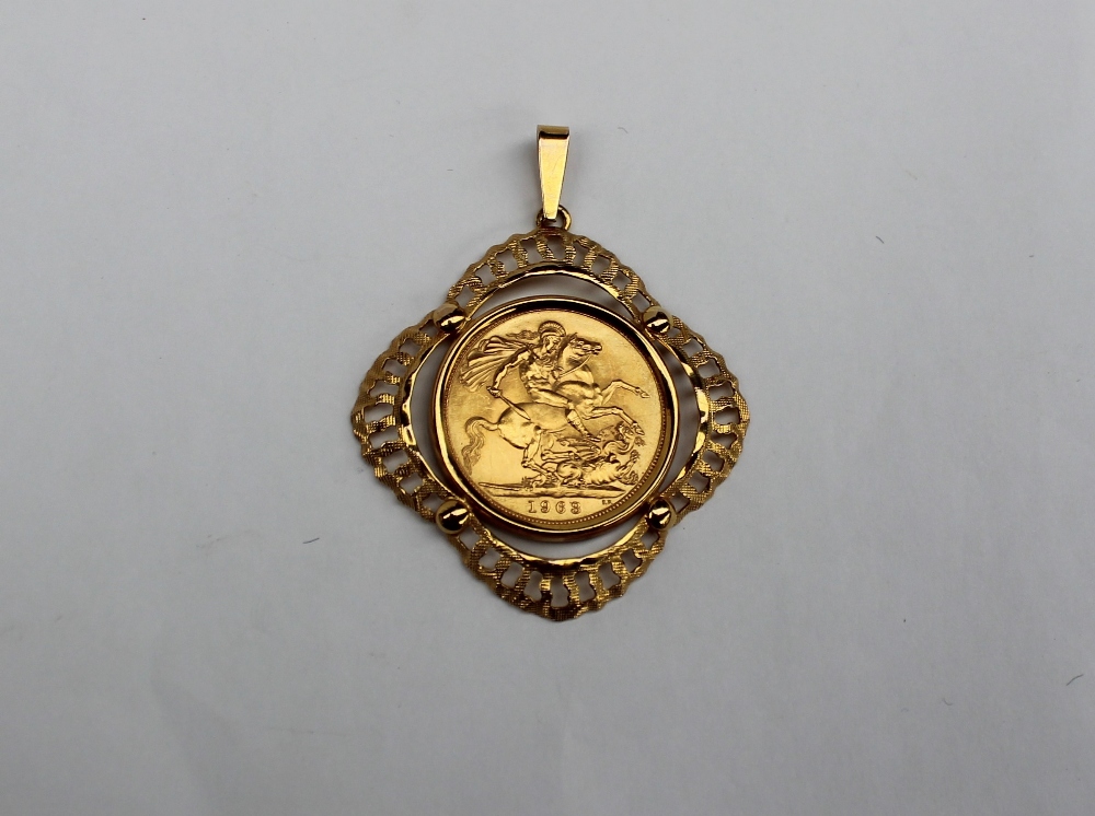 An Elizabeth II gold sovereign dated 1963 in a 9ct gold mount, approximately 10.