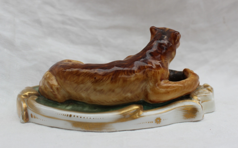 A 19th century porcelain figure group of a lion subduing a deer, on a scrolling oval base, 14. - Image 3 of 4