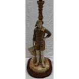 A Royal Worcester porcelain "Cricklite" blush ivory lamp base of a gentleman holding a basket