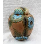 A Crown Devon Ginger Jar and Cover, decorated with blue and green flowers, highlighted in gold,