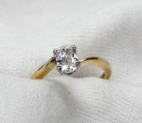 A solitaire diamond ring, the oval faceted diamond approximately 0.