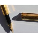 An S.J. Dupont yellow metal fountain pen, with a panelled tapering body, No.