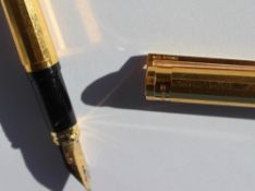 An S.J. Dupont yellow metal fountain pen, with a panelled tapering body, No.