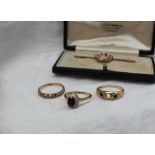 A garnet and paste set dress ring,