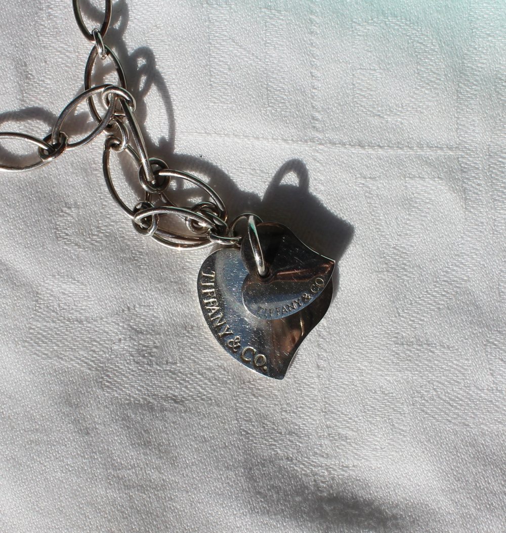 A silver Tiffany & Co necklace, with oval links and a heart pendant, approximately 22 grams, - Image 2 of 3
