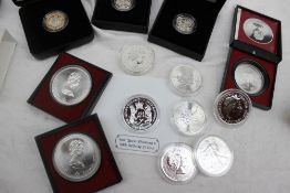 A 90th Birthday silver £5 coin, together with two silver Montreal Olympics 1976 10 dollars coin,