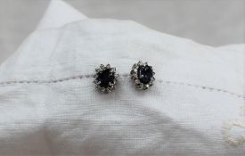 A pair of sapphire and diamond stud earrings,