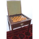 An Edwardian mahogany games table,