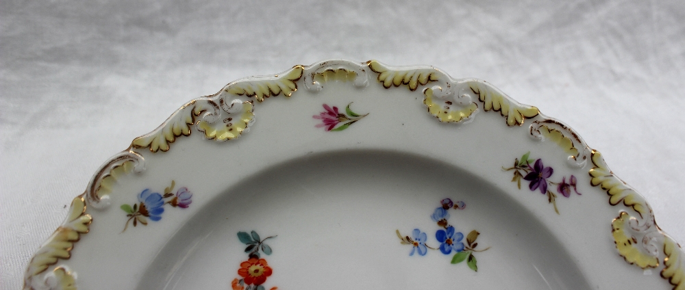 A Meissen porcelain side plate, with a shaped raised edge painted with small flowerheads, - Image 4 of 4