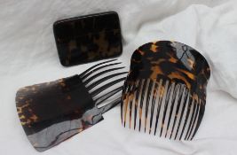 A pair of faux tortoiseshell hair combs,