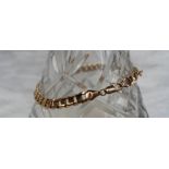 A 9ct yellow gold bracelet with S shaped links approximately 11 grams