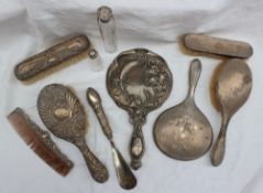 A silver backed part dressing table set together with various silver backed mirrors etc