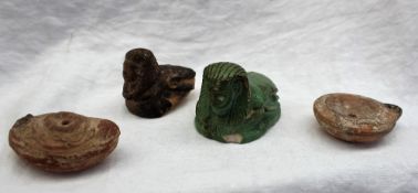 A carved hardstone model of the Egyptian Sphinx, in green,