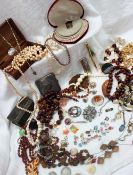 A Collection of costume jewellery including brooches, faux pearls, necklaces,