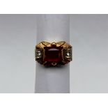 A ruby and paste set dress ring,